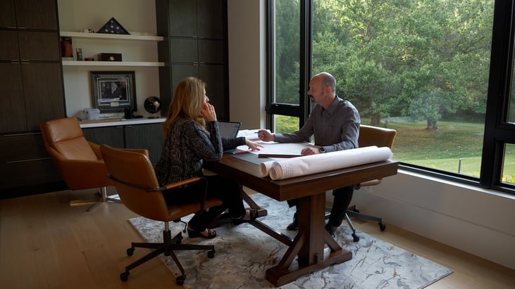 Francisca and Tony Alonso working in the Architect House in Great Falls Virginia by AV Architects and Builders